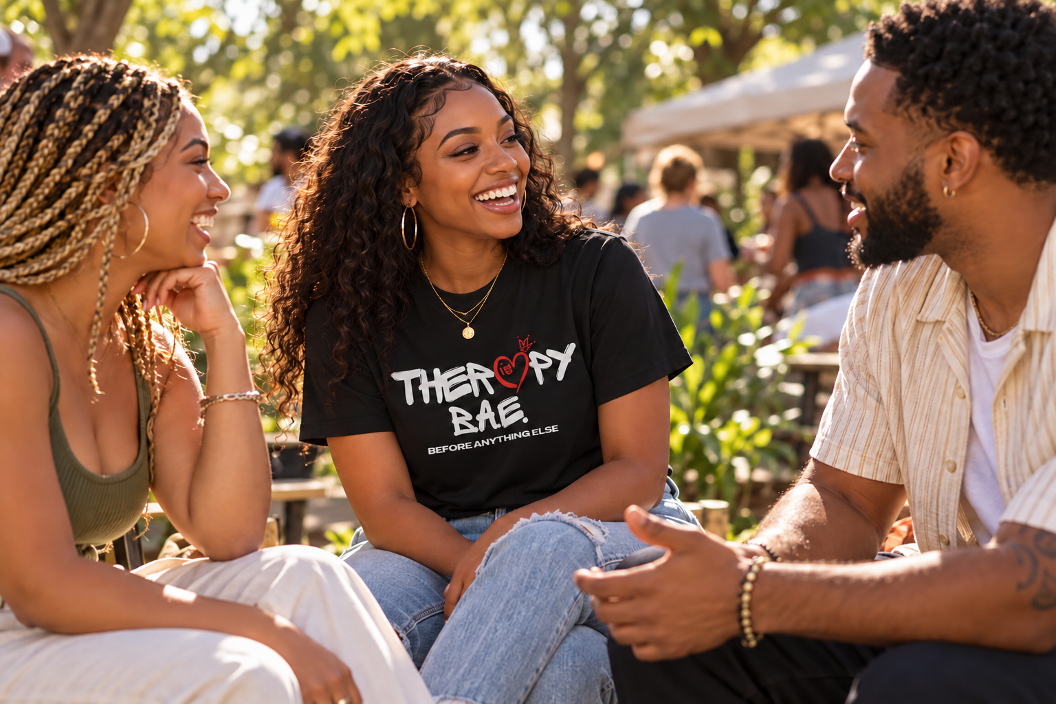Illustrative scene of three adults talking outdoors, one wearing a Therapy Is BAE shirt