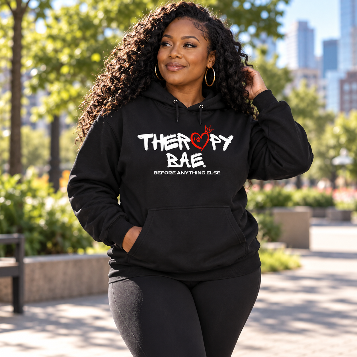 Illustrative model wearing a black Therapy Is BAE hoodie